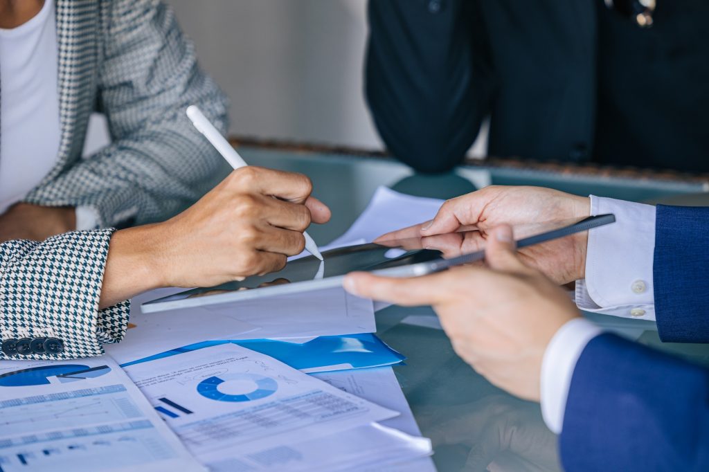 closeup business women hand digital signing contract. Deal project on tablet for business investment