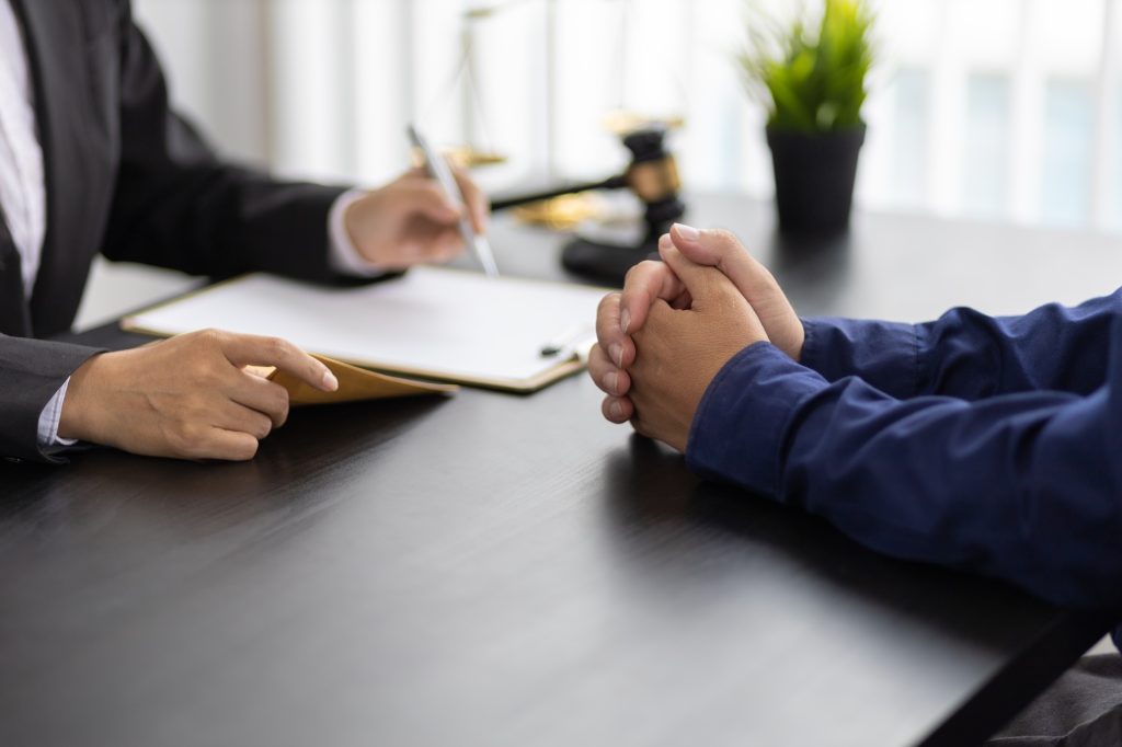 Lawyers discussing contract papers desk in office. Law, legal services, advice, Justice concept.